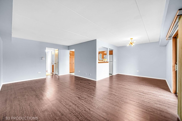 8124 168th Pl Unit 1E, Tinley Park, IL 60477 - unfurnished living room with wood finished floors and baseboards