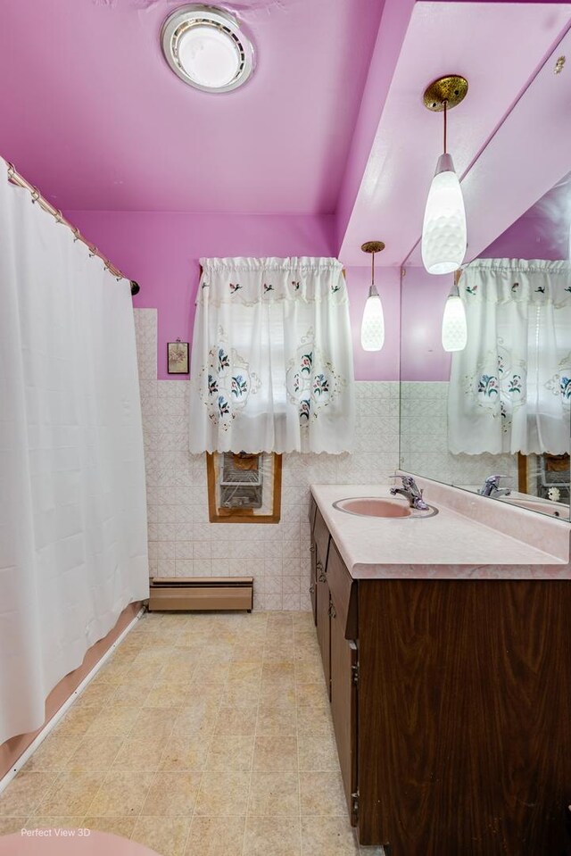 1903 Marshall Pkwy, Waukegan, IL 60085 - full bathroom featuring baseboard heating, vanity, and a shower with shower curtain