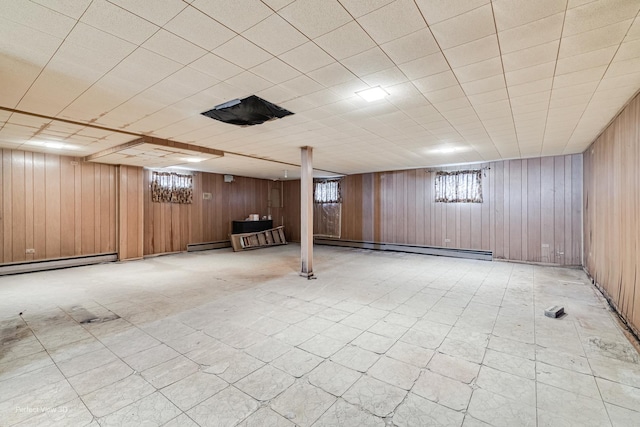 1903 Marshall Pkwy, Waukegan, IL 60085 - basement featuring baseboard heating and wood walls