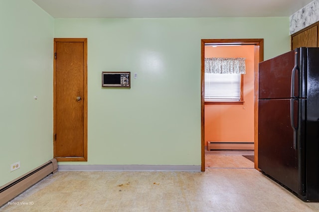 1903 Marshall Pkwy, Waukegan, IL 60085 - kitchen featuring freestanding refrigerator, a baseboard heating unit, light floors, and baseboards