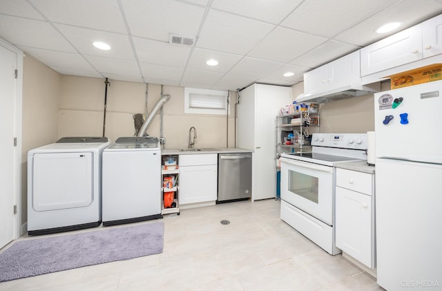 1405 Cynthia Ave, Park Ridge, IL 60068 - kitchen featuring white appliances, washer and dryer, white cabinetry, a sink, and recessed lighting