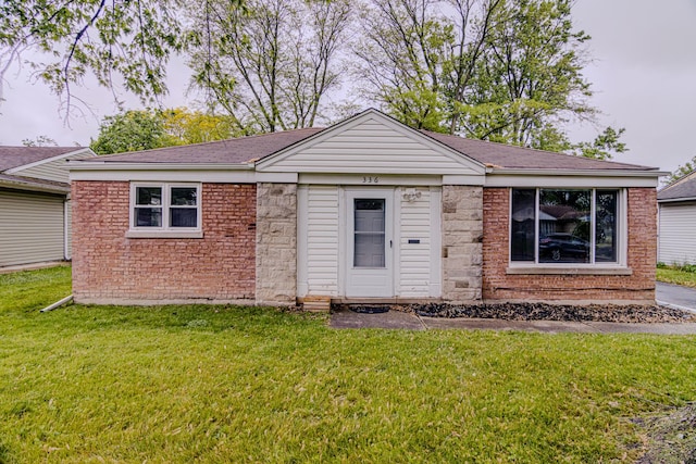 336 Manitowac St, Park Forest, IL 60466 - ranch-style home featuring a front yard, a shingled roof, and brick siding