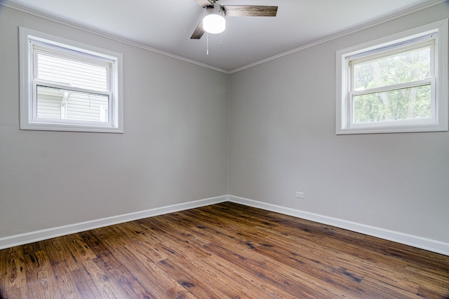 336 Manitowac St, Park Forest, IL 60466 - spare room featuring ornamental molding, dark wood-type flooring, and a ceiling fan