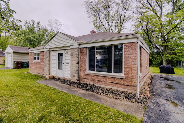 336 Manitowac St, Park Forest, IL 60466 - single story home featuring a front lawn, brick siding, and a chimney