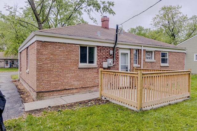 336 Manitowac St, Park Forest, IL 60466 - rear view of house with a wooden deck, a chimney, brick siding, and a lawn