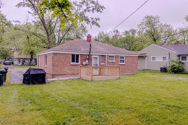 336 Manitowac St, Park Forest, IL 60466 - rear view of property with brick siding, a wooden deck, a chimney, and a yard