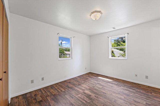 1305 W Beardsley Ave, Urbana, IL 61801 - unfurnished room featuring healthy amount of natural light and wood finished floors