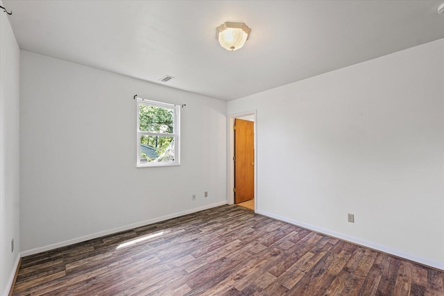1305 W Beardsley Ave, Urbana, IL 61801 - unfurnished room with wood finished floors and baseboards