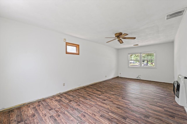 1305 W Beardsley Ave, Urbana, IL 61801 - empty room with wood finished floors, a ceiling fan, and heating unit