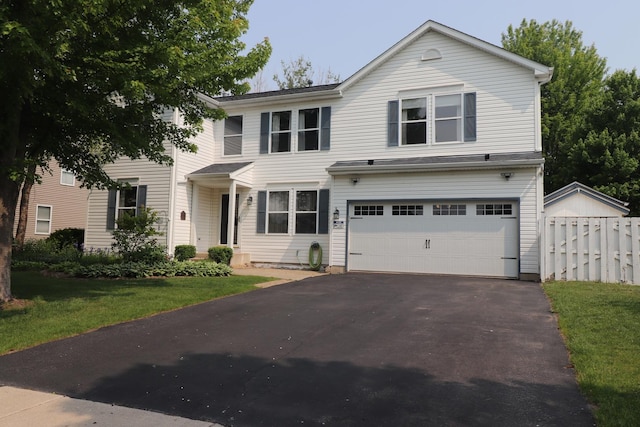 2886 E 6th St, Belvidere, IL 61008 - traditional-style home with a garage and driveway
