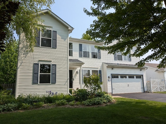 2886 E 6th St, Belvidere, IL 61008 - view of front of house featuring driveway and an attached garage