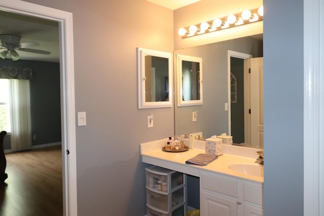 2886 E 6th St, Belvidere, IL 61008 - bathroom with vanity, ceiling fan, and wood finished floors