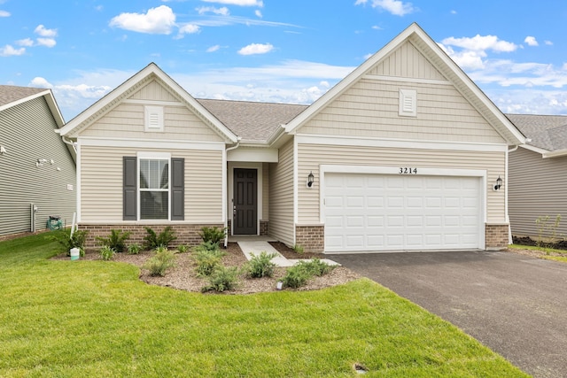 3214 Lincoln Prairie Blvd, Aurora, IL 60503 - view of front of house featuring brick siding, driveway, a front yard, and an attached garage