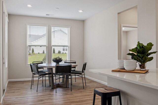 3214 Lincoln Prairie Blvd, Aurora, IL 60503 - dining room with light wood finished floors, baseboards, and recessed lighting
