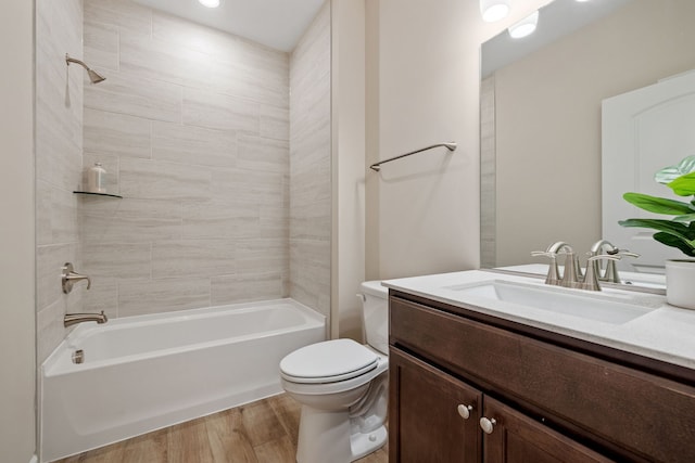 3214 Lincoln Prairie Blvd, Aurora, IL 60503 - bathroom featuring toilet, vanity, washtub / shower combination, and wood finished floors