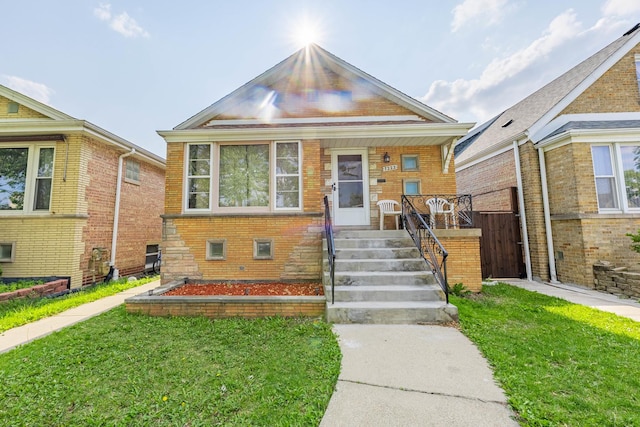 7222 S Christiana Ave, Chicago, IL 60629 - view of front of property with a front yard, a porch, and brick siding