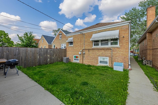 7222 S Christiana Ave, Chicago, IL 60629 - view of home's exterior with brick siding and a central air condition unit