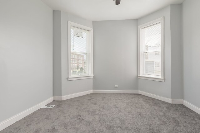 6132 S Justine St, Chicago, IL 60636 - spare room featuring carpet, a ceiling fan, and baseboards