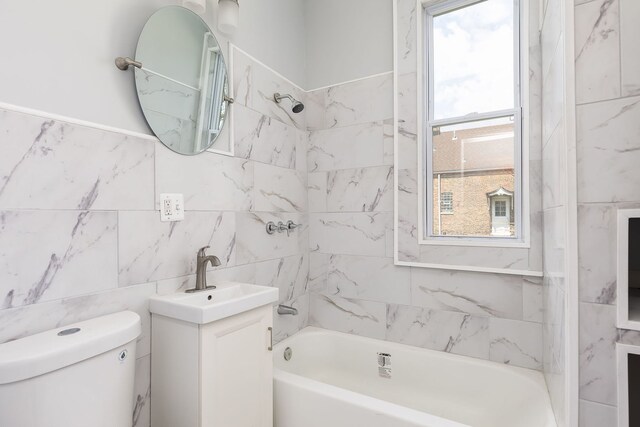 6132 S Justine St, Chicago, IL 60636 - full bathroom featuring tile walls, toilet, tub / shower combination, and vanity