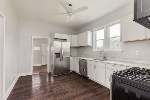 6132 S Justine St, Chicago, IL 60636 - kitchen with stainless steel appliances, a sink, a ceiling fan, light countertops, and dark wood-style flooring