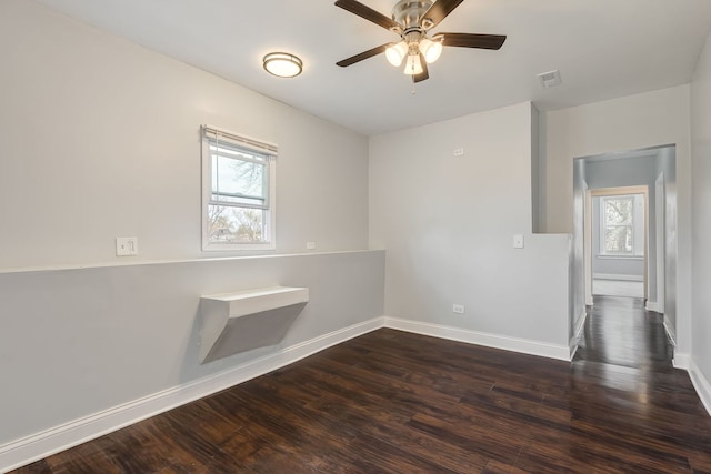 6132 S Justine St, Chicago, IL 60636 - unfurnished room with baseboards, dark wood finished floors, and a ceiling fan