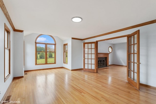 13714 S Janas Pkwy, Homer Glen, IL 60491 - unfurnished living room featuring french doors, light wood finished floors, ornamental molding, baseboards, and a fireplace with flush hearth