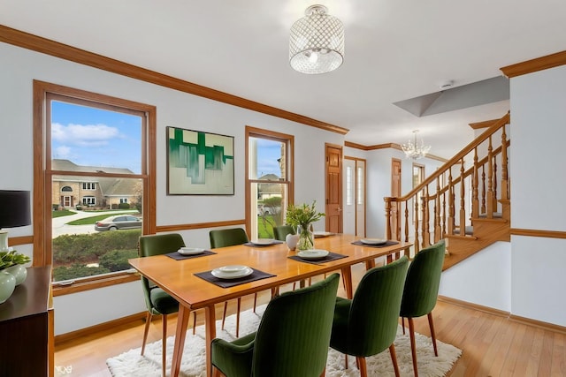 13714 S Janas Pkwy, Homer Glen, IL 60491 - dining room with a chandelier, stairs, baseboards, plenty of natural light, and crown molding