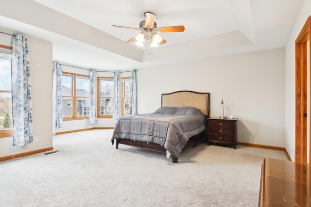 24725 Hanover Ct, Plainfield, IL 60585 - bedroom with carpet, a tray ceiling, and ceiling fan
