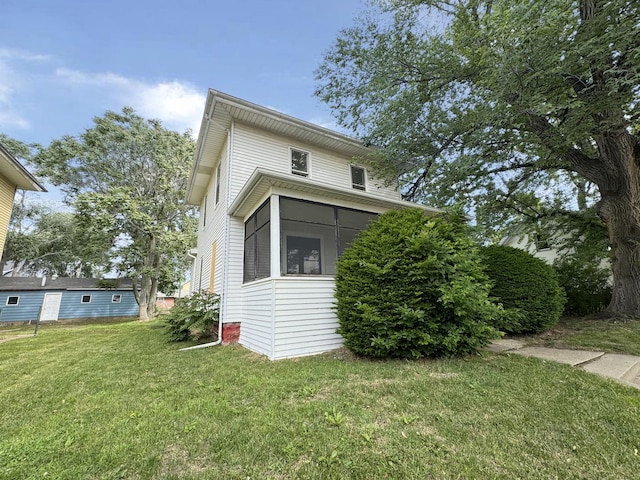 1306 E 4th St, Sterling, IL 61081 - view of home's exterior with a lawn