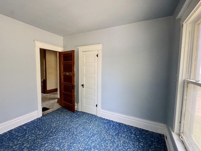 1306 E 4th St, Sterling, IL 61081 - empty room with carpet floors and baseboards
