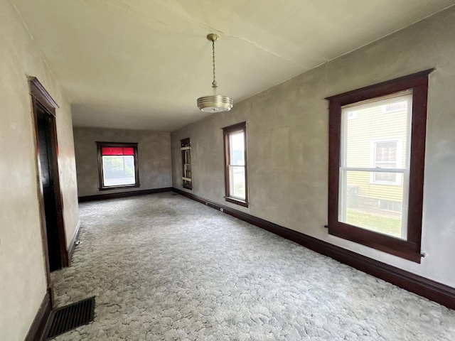 1306 E 4th St, Sterling, IL 61081 - empty room with carpet, baseboards, and plenty of natural light
