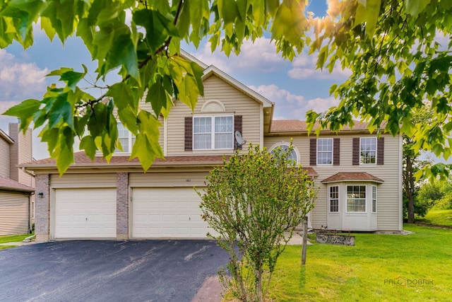 1927 Oaktree Trl, Lake Villa, IL 60046 - view of front of property with driveway, a front lawn, and a garage