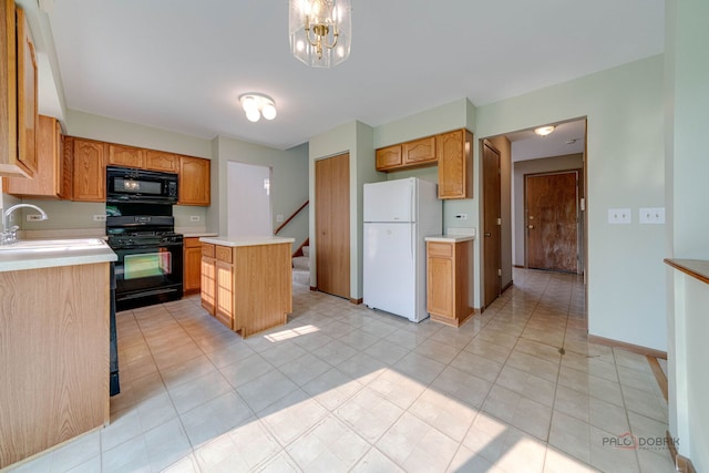 1927 Oaktree Trl, Lake Villa, IL 60046 - kitchen featuring black appliances, light countertops, a center island, light tile patterned flooring, and a chandelier