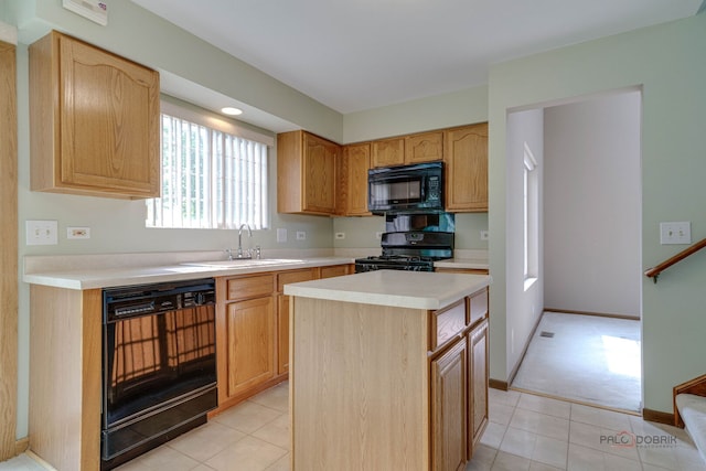 1927 Oaktree Trl, Lake Villa, IL 60046 - kitchen with black appliances, a sink, light countertops, a kitchen island, and light tile patterned flooring