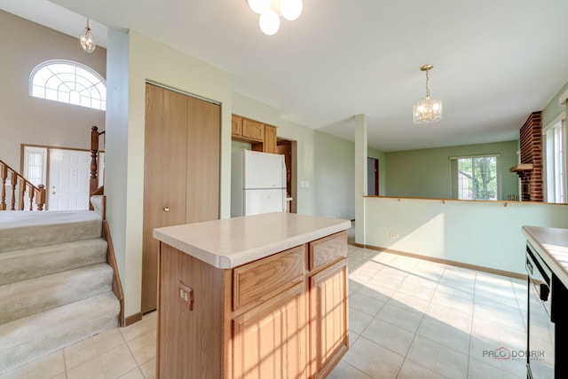 1927 Oaktree Trl, Lake Villa, IL 60046 - kitchen featuring freestanding refrigerator, open floor plan, light countertops, and a kitchen island
