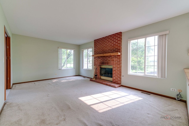 1927 Oaktree Trl, Lake Villa, IL 60046 - unfurnished living room with carpet floors, baseboards, and a fireplace