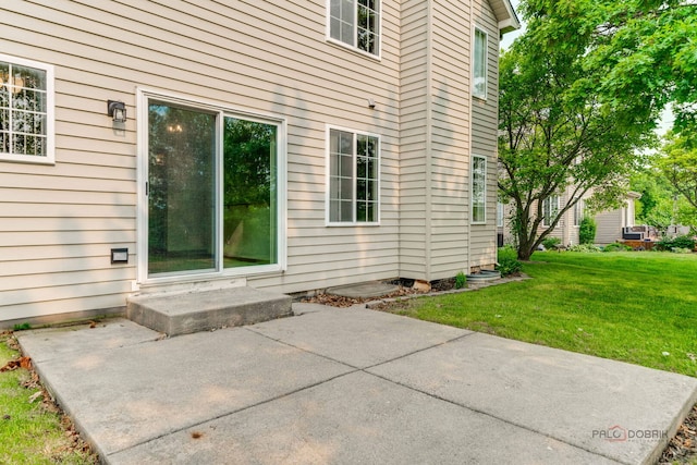 1927 Oaktree Trl, Lake Villa, IL 60046 - property entrance featuring a patio area and a lawn