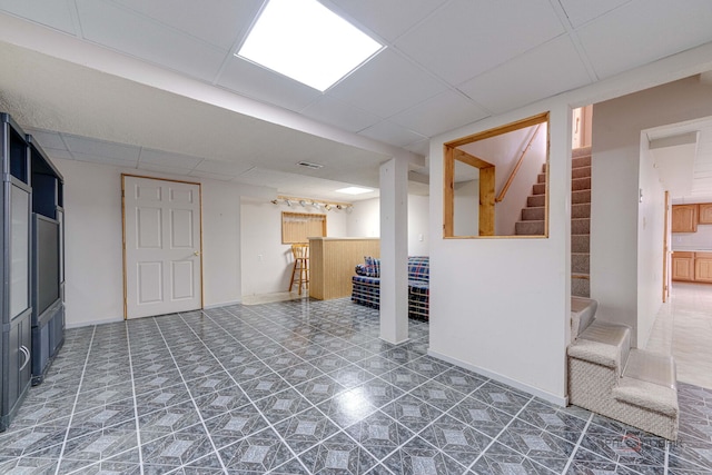 1927 Oaktree Trl, Lake Villa, IL 60046 - finished below grade area featuring a paneled ceiling, stairs, and tile patterned floors