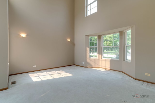 1927 Oaktree Trl, Lake Villa, IL 60046 - carpeted empty room featuring baseboards and a high ceiling