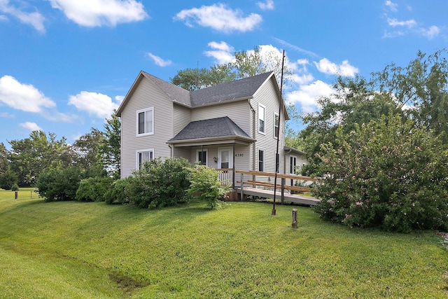4391 N State Route 1-17, Momence, IL 60954 - rear view of property featuring a lawn, a shingled roof, and a wooden deck