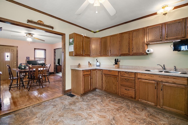 4391 N State Route 1-17, Momence, IL 60954 - kitchen featuring ceiling fan, light countertops, brown cabinets, and crown molding