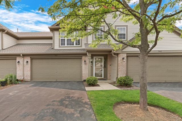 743 Sycamore Ct, Lindenhurst, IL 60046 - view of property with brick siding, driveway, and a shingled roof