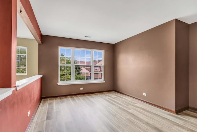 743 Sycamore Ct, Lindenhurst, IL 60046 - spare room with light wood-style flooring and baseboards