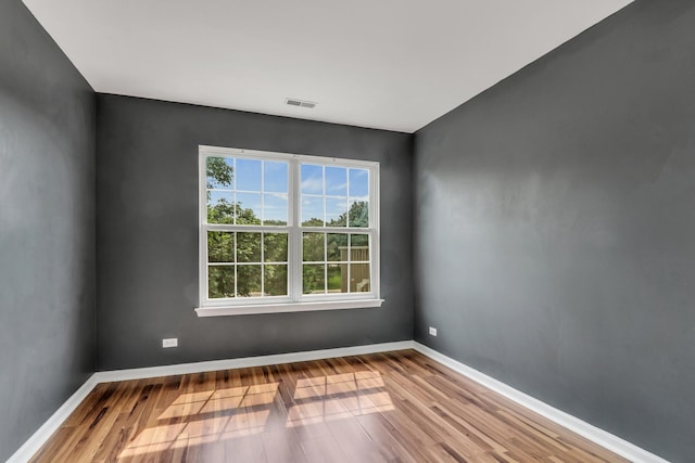 743 Sycamore Ct, Lindenhurst, IL 60046 - unfurnished room with wood finished floors and baseboards