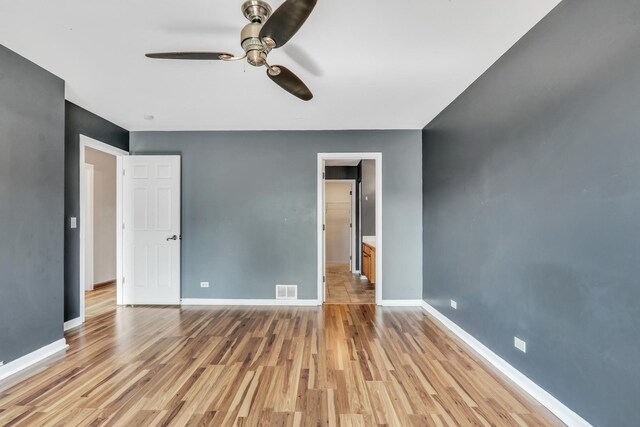 743 Sycamore Ct, Lindenhurst, IL 60046 - unfurnished bedroom featuring light wood finished floors and a ceiling fan