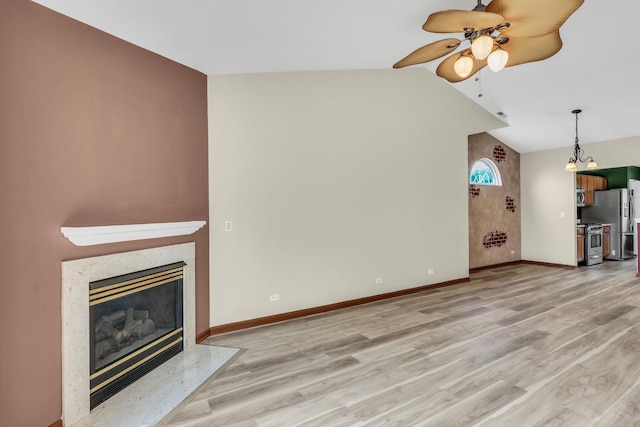 743 Sycamore Ct, Lindenhurst, IL 60046 - unfurnished living room featuring ceiling fan, light wood finished floors, a high end fireplace, and vaulted ceiling