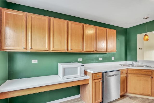743 Sycamore Ct, Lindenhurst, IL 60046 - kitchen featuring dishwasher, white microwave, light wood finished floors, light countertops, and hanging light fixtures