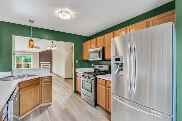 743 Sycamore Ct, Lindenhurst, IL 60046 - kitchen featuring appliances with stainless steel finishes, light wood finished floors, light countertops, decorative light fixtures, and ceiling fan