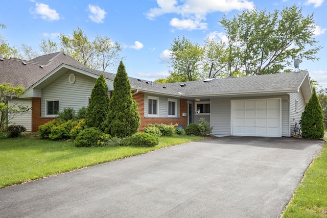 1850 Pierce Rd, Hoffman Estates, IL 60169 - ranch-style home featuring a garage, brick siding, driveway, a front lawn, and a shingled roof