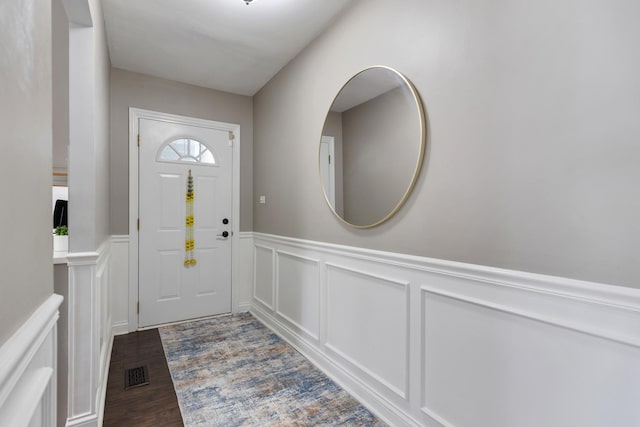 1850 Pierce Rd, Hoffman Estates, IL 60169 - entrance foyer with a decorative wall, wainscoting, and dark wood finished floors